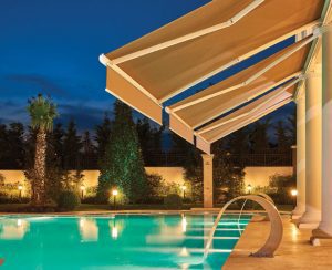 Cassette retractable awning shading near a pool