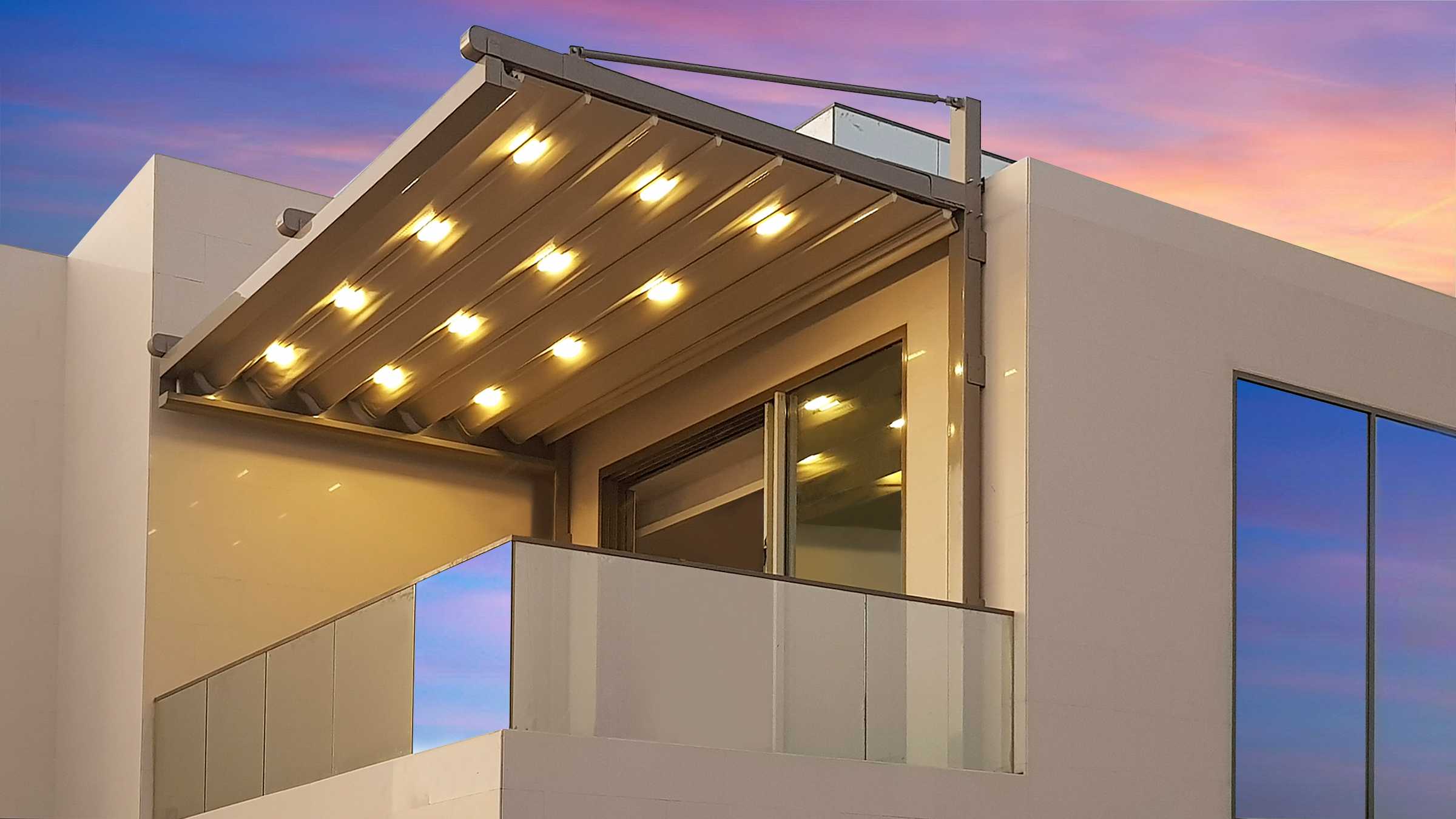 Retractable pergola with integrated lights shading a balcony at a villa in Dubai